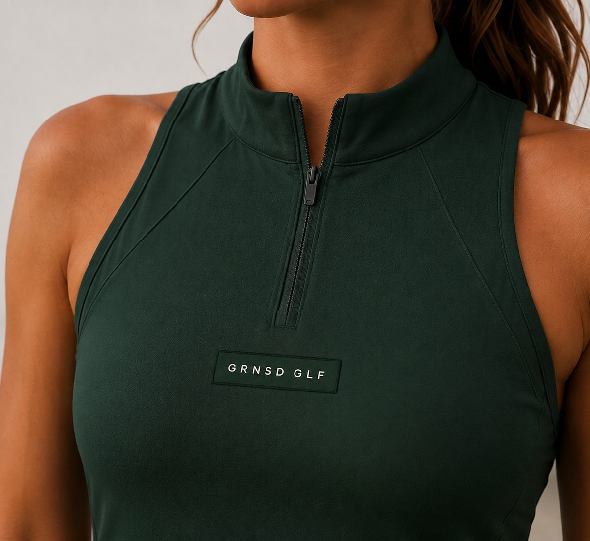 Close-up of GRNSD GLF quarter-zip dress detail